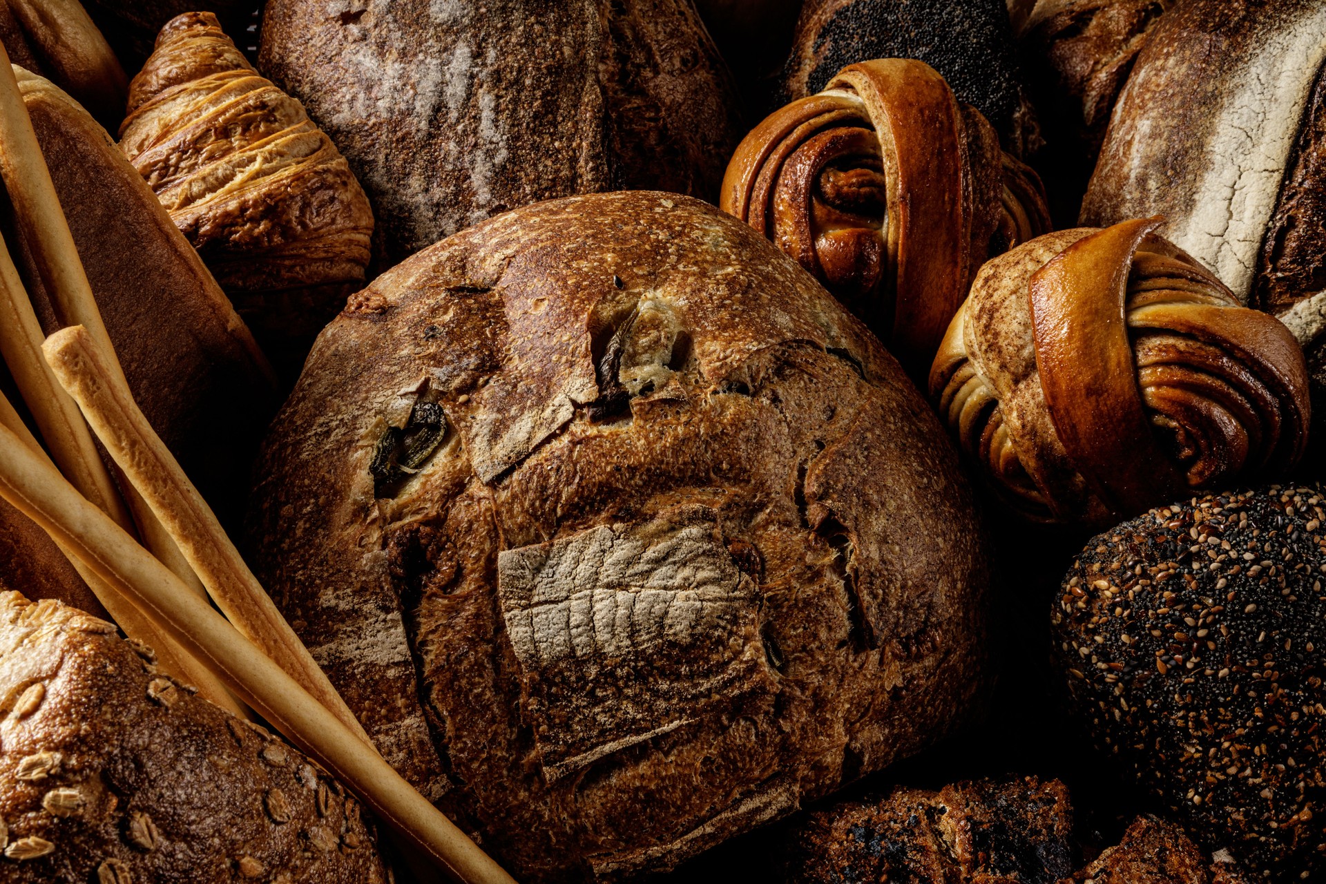 A stunning variety of artisanal bread beautifully displayed for your enjoyment and delight